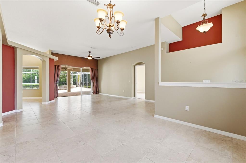 1450 Warrington Way Trinity, FL 34655 - Photo 8 of 62 wooden floor in an empty room with a window