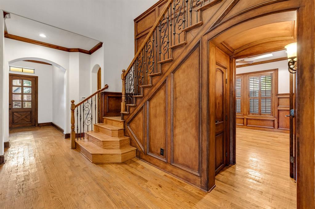18231 Brighton Green Dallas, TX 75252 - Photo 16 of 36 a view of entryway and hall with wooden floor