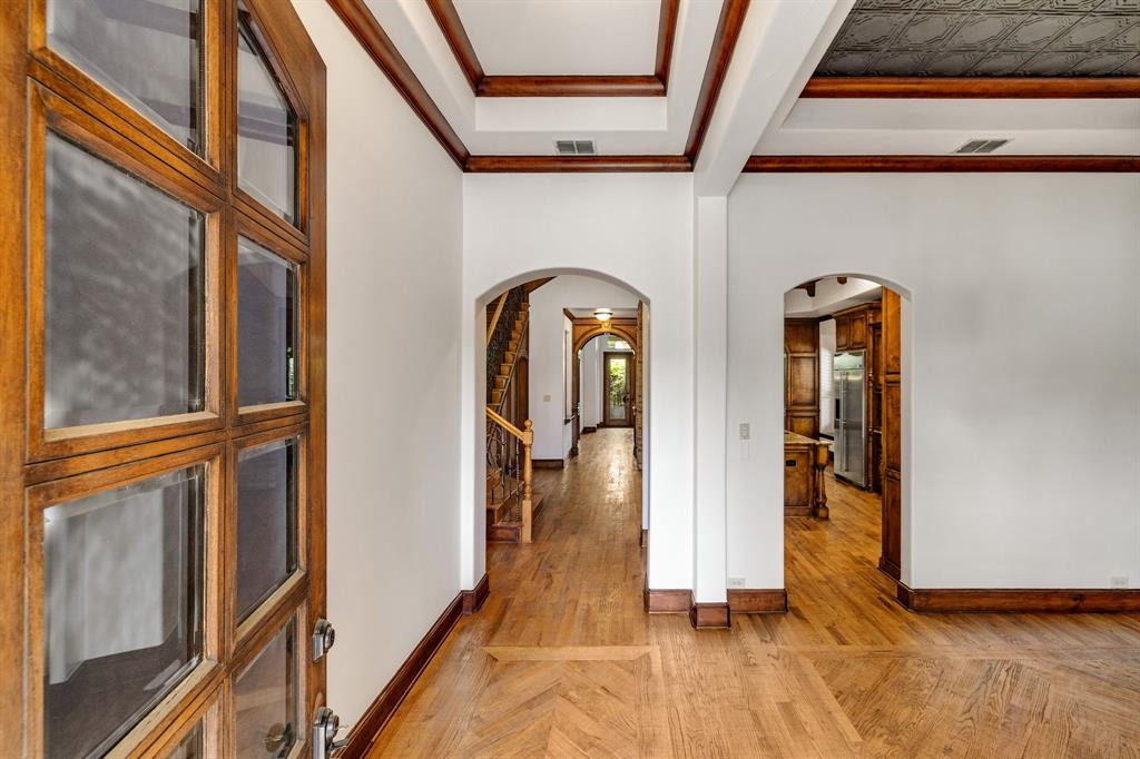 18231 Brighton Green Dallas, TX 75252 - Photo 2 of 36 a view of an entryway with wooden floor