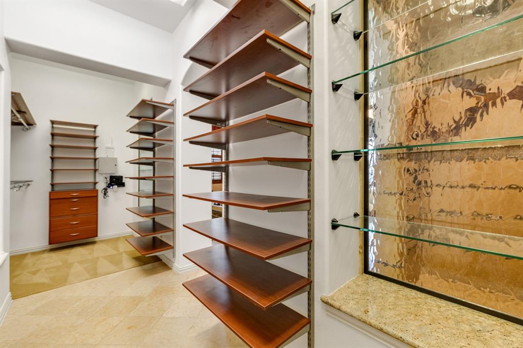18231 Brighton Green Dallas, TX 75252 - Photo 26 of 36 a view of an empty walk in closet