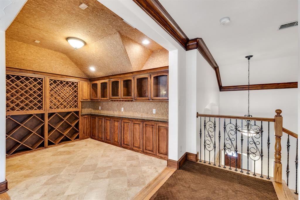 18231 Brighton Green Dallas, TX 75252 - Photo 29 of 36 a view of a house with wooden floor and wooden fence