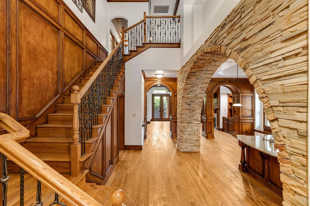 18231 Brighton Green Dallas, TX 75252 - Photo 3 of 36 a view of entryway and hall with wooden floor