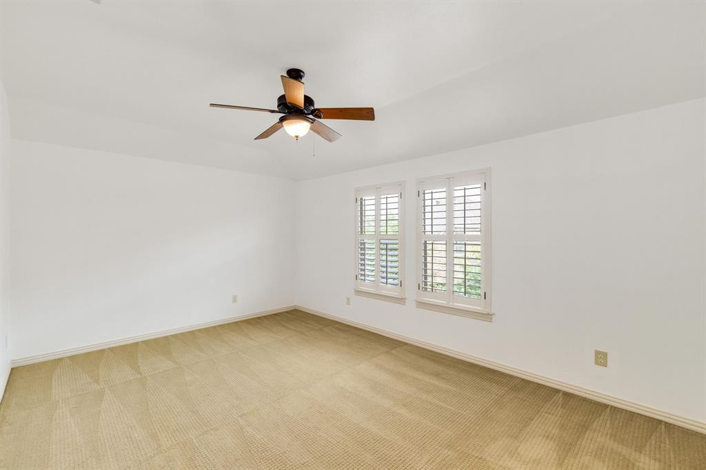 18231 Brighton Green Dallas, TX 75252 - Photo 34 of 36 a view of room with a ceiling fan and window