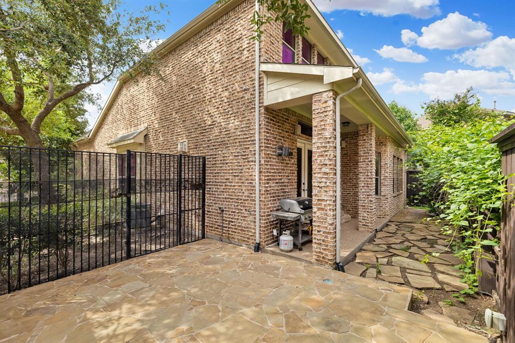 18231 Brighton Green Dallas, TX 75252 - Photo 35 of 36 a view of a house with a small yard and wooden fence