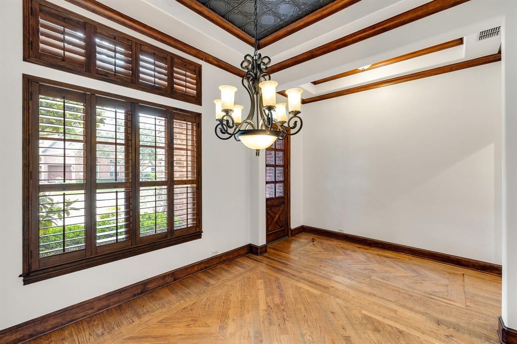 18231 Brighton Green Dallas, TX 75252 - Photo 4 of 36 a view of a room with a large window and chandelier