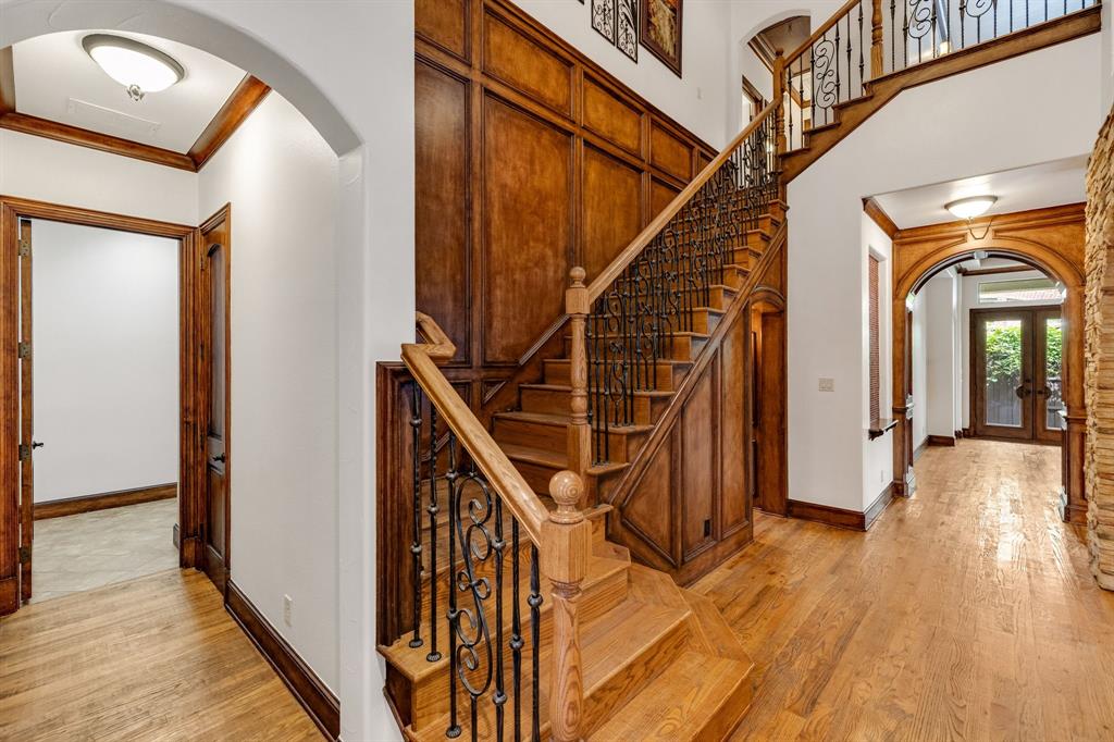 18231 Brighton Green Dallas, TX 75252 - Photo 5 of 36 a view of entryway with wooden floor and stairs
