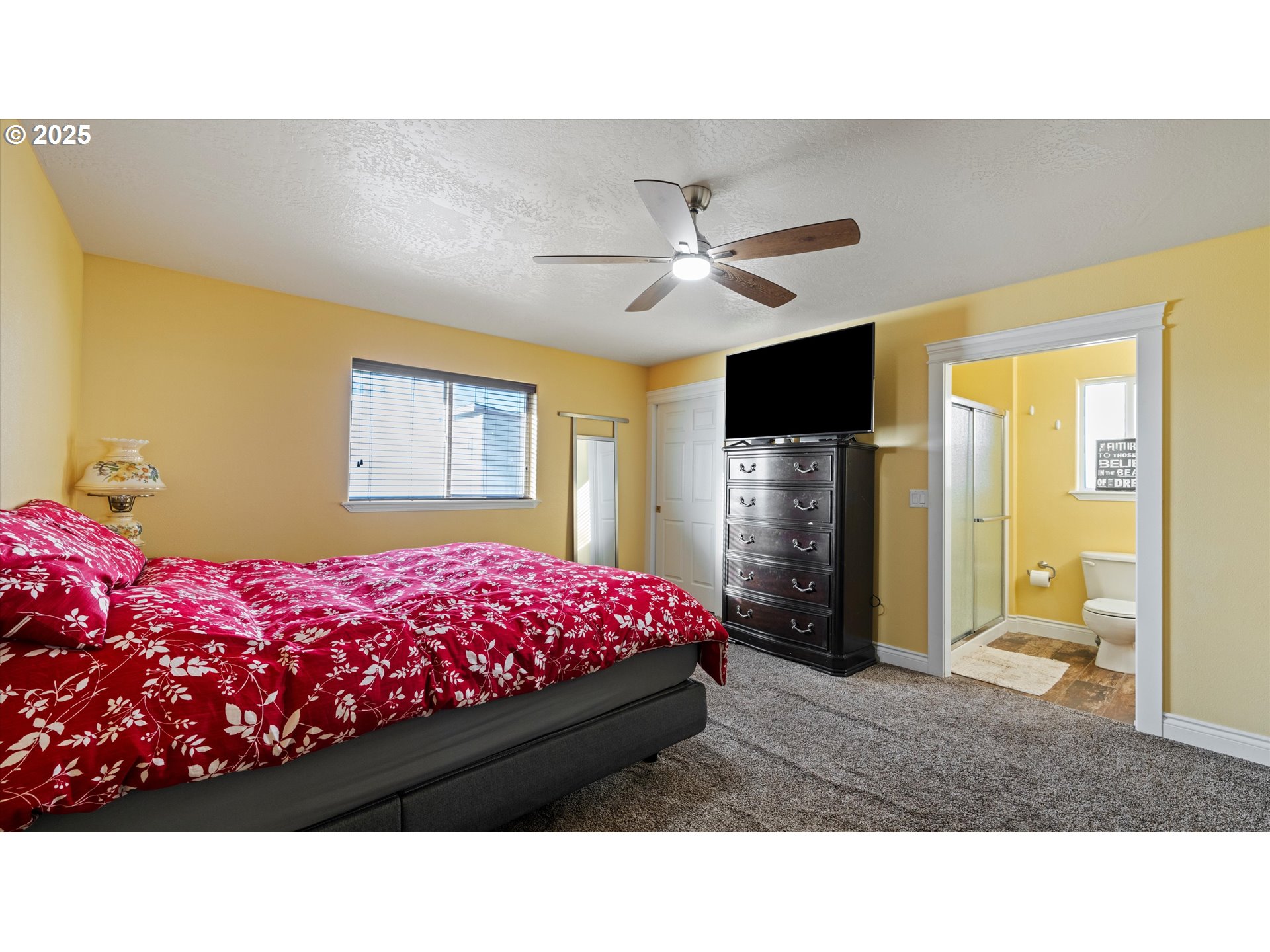 751 West Joseph Avenue Hermiston, OR 97838 - Photo 12 of 17 a room with a bed dresser and a large mirror