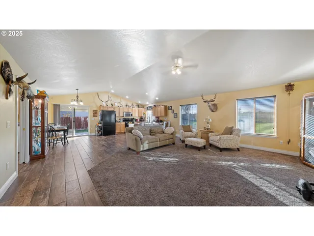 a living room with lots of furniture and a flat screen tv