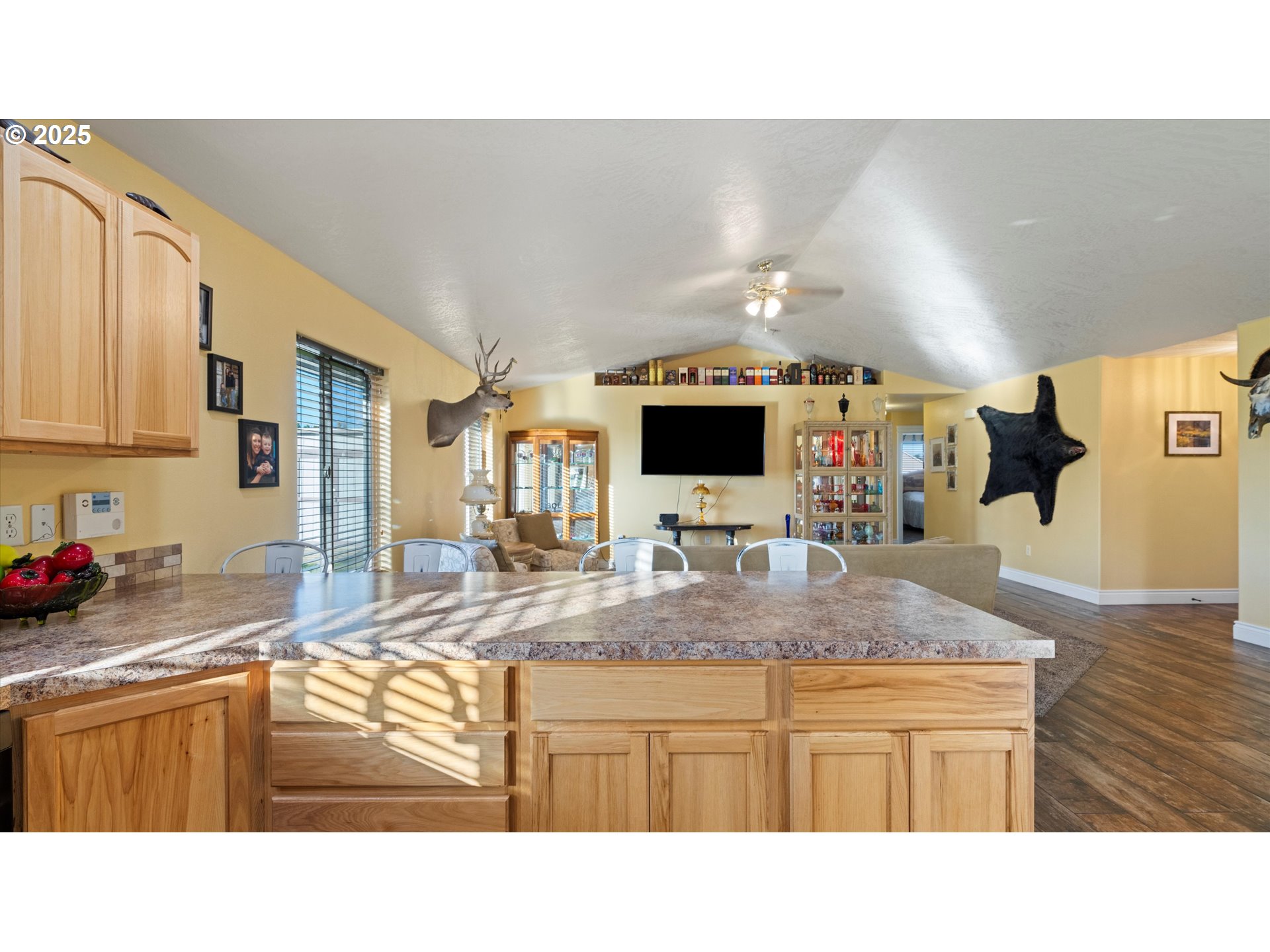 751 West Joseph Avenue Hermiston, OR 97838 - Photo 8 of 17 a kitchen with kitchen island granite countertop a sink window and cabinets