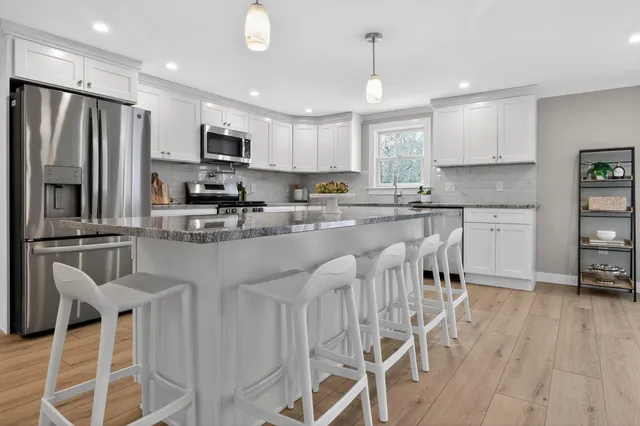 a bedroom with bed and window