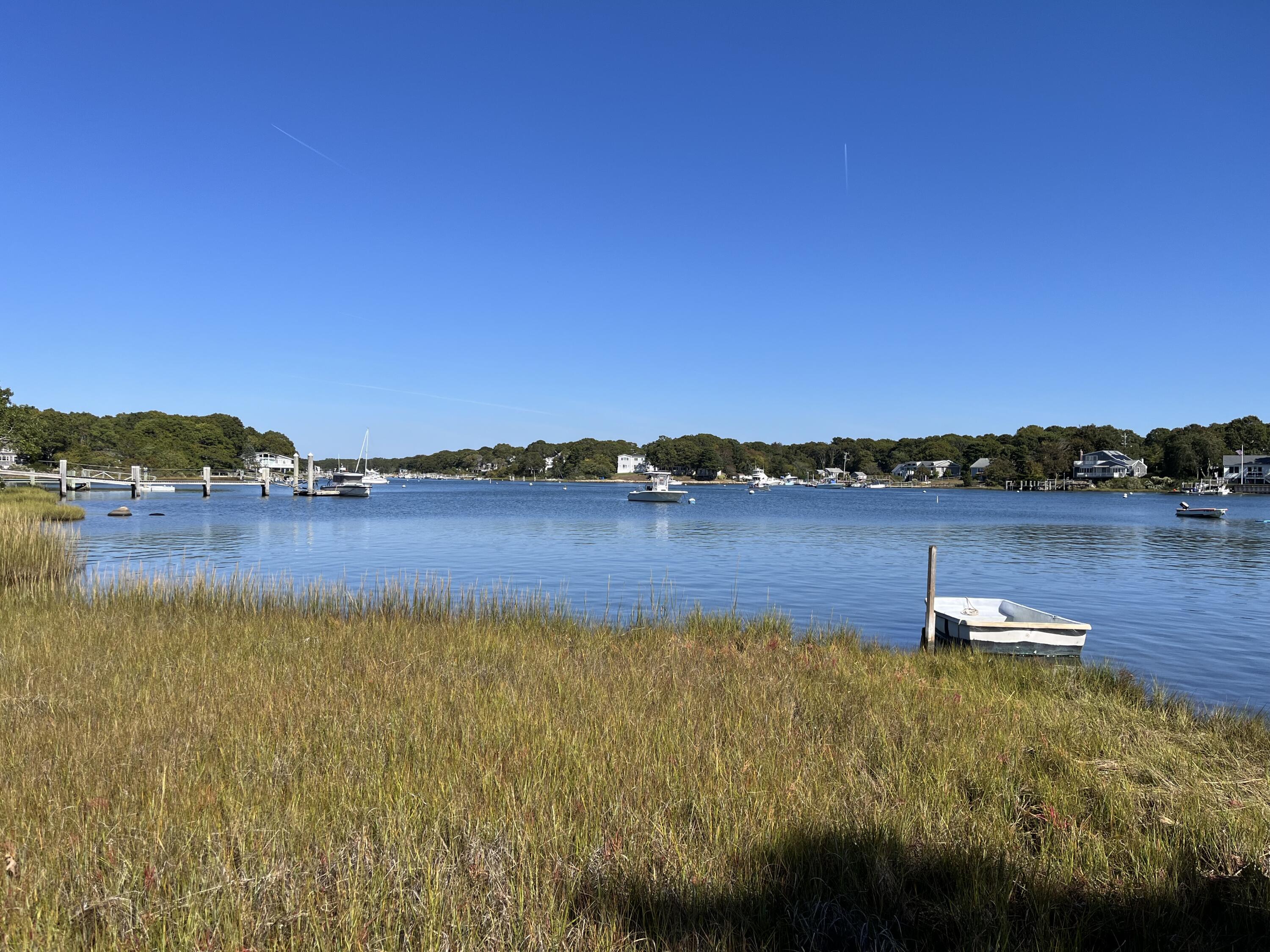 53 Eel River Road East Falmouth, MA 02536 - Photo 2 of 42 a view of a lake with houses in the back