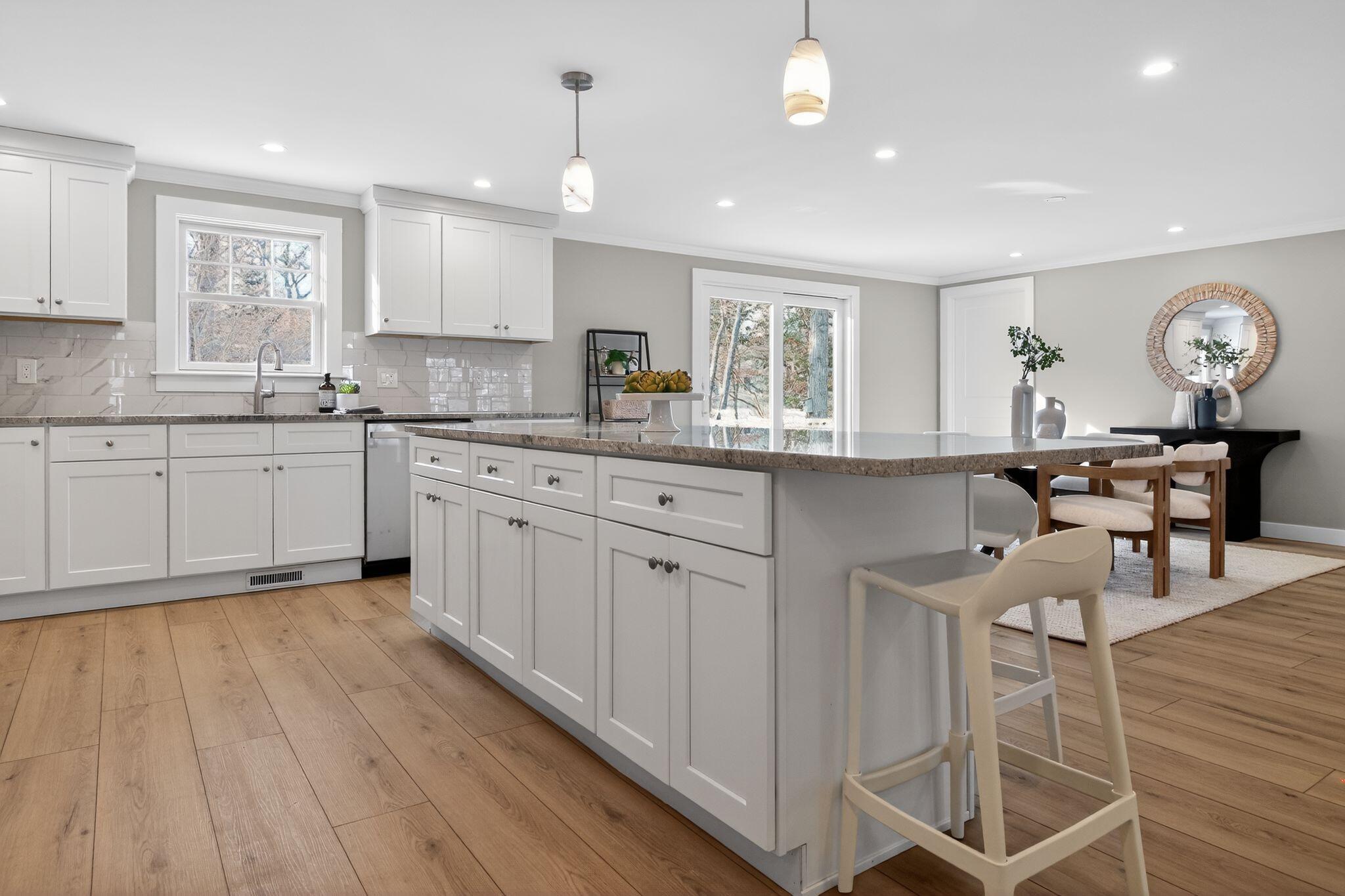 53 Eel River Road East Falmouth, MA 02536 - Photo 21 of 42 a kitchen with a sink window and cabinets