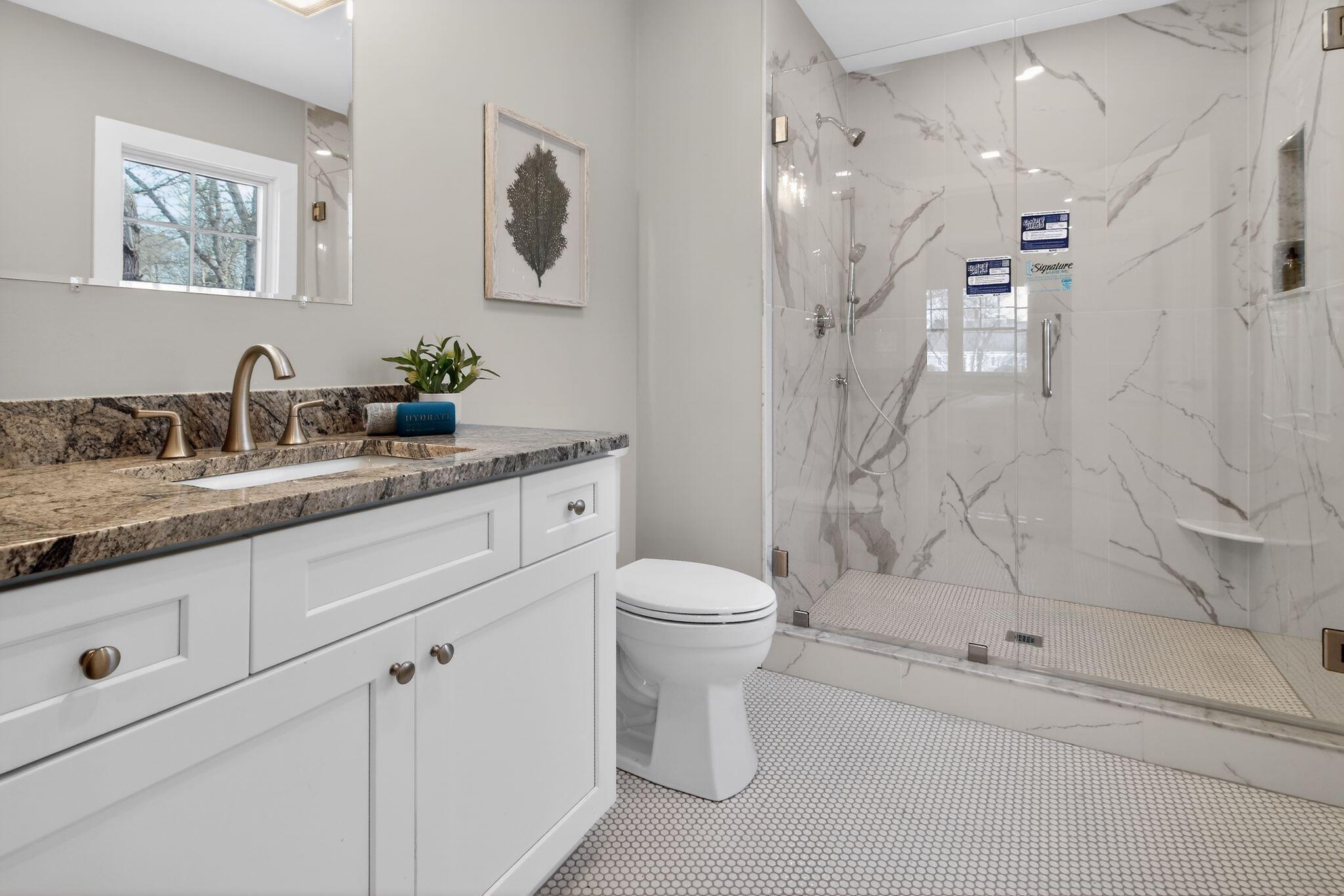 53 Eel River Road East Falmouth, MA 02536 - Photo 39 of 42 a bathroom with a granite countertop sink mirror vanity and toilet