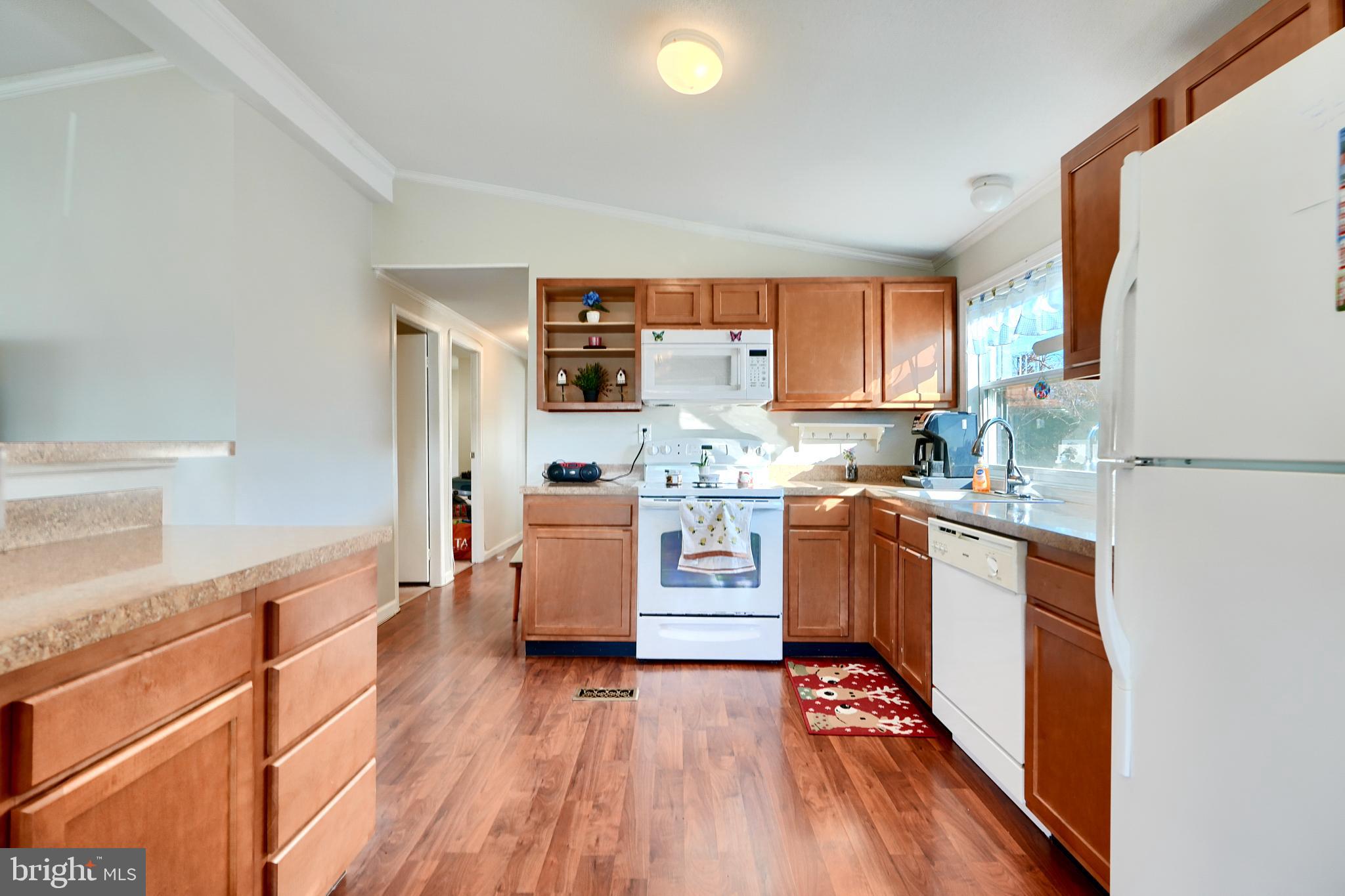 127 Cowhide Circle Baltimore, MD 21220 - Photo 11 of 27 a kitchen with granite countertop a refrigerator stove top oven and sink