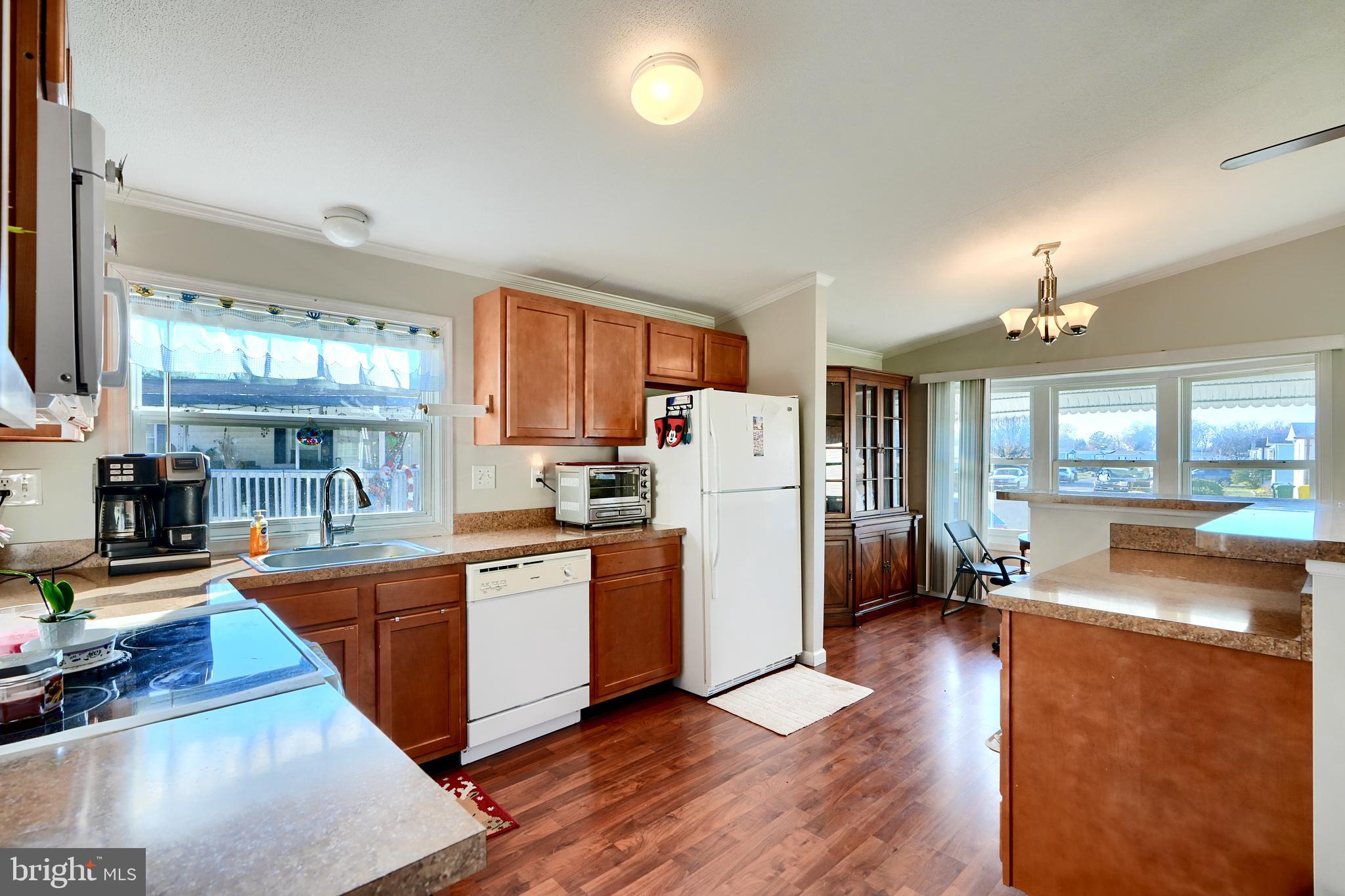 127 Cowhide Circle Baltimore, MD 21220 - Photo 12 of 27 a large kitchen with cabinets a counter top space a sink a refrigerator and a view of living room