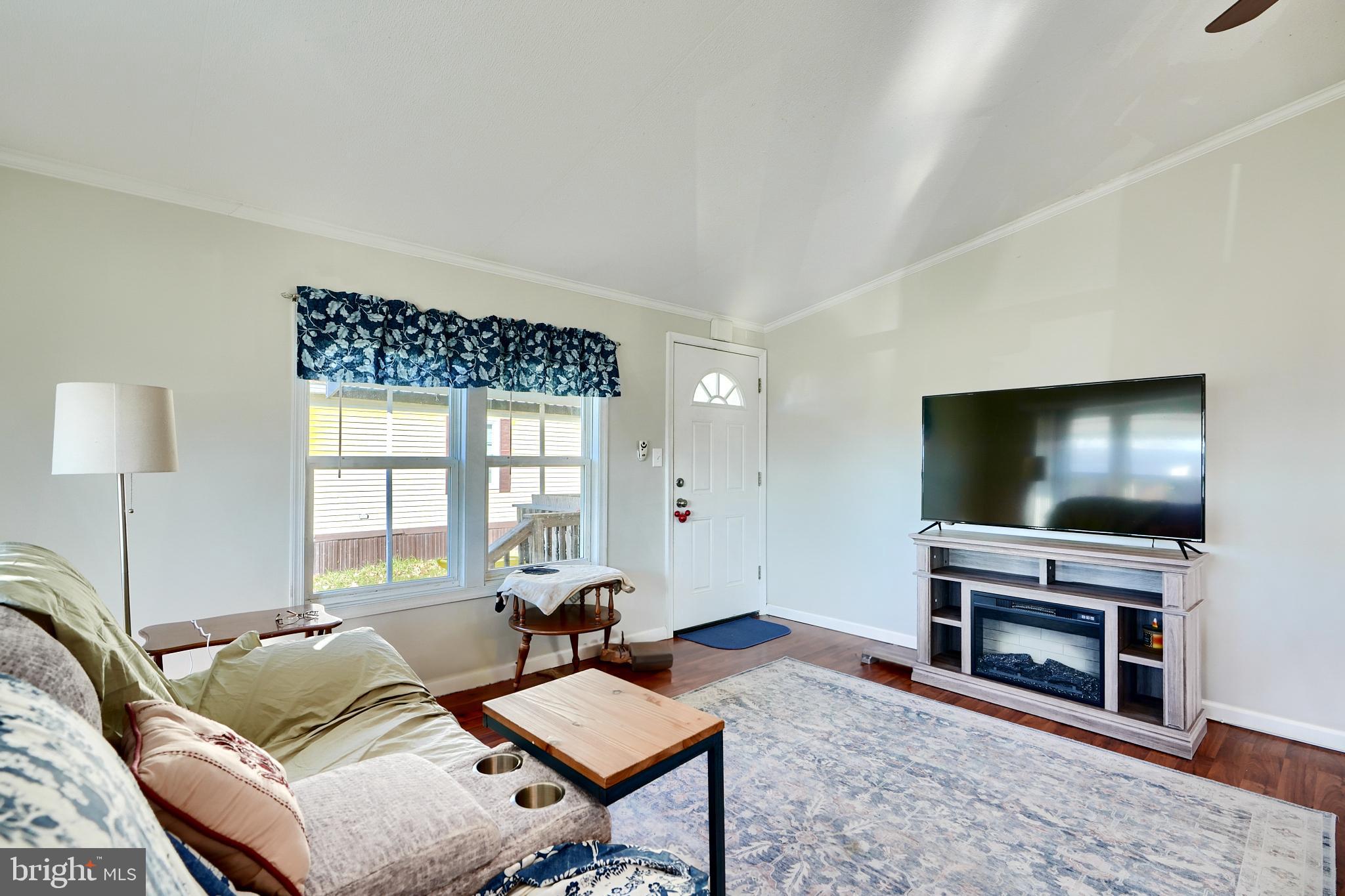 127 Cowhide Circle Baltimore, MD 21220 - Photo 6 of 27 a living room with furniture and a flat screen tv
