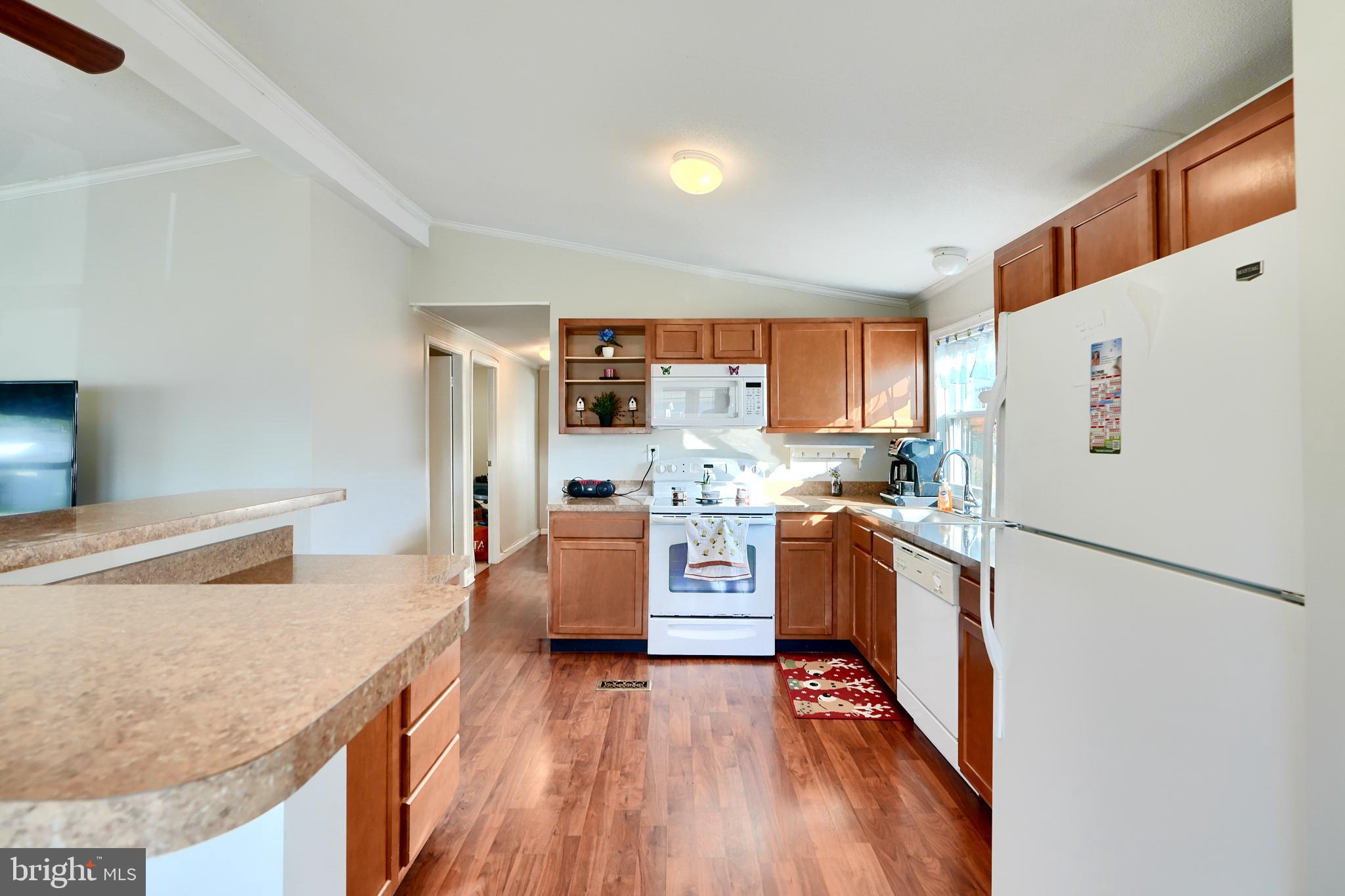 127 Cowhide Circle Baltimore, MD 21220 - Photo 10 of 27 a kitchen with stainless steel appliances granite countertop a refrigerator a stove top oven and a sink