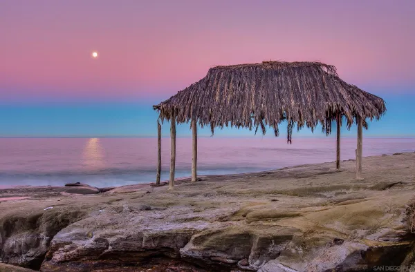 a large kitchen with kitchen island a stove a sink and a refrigerator