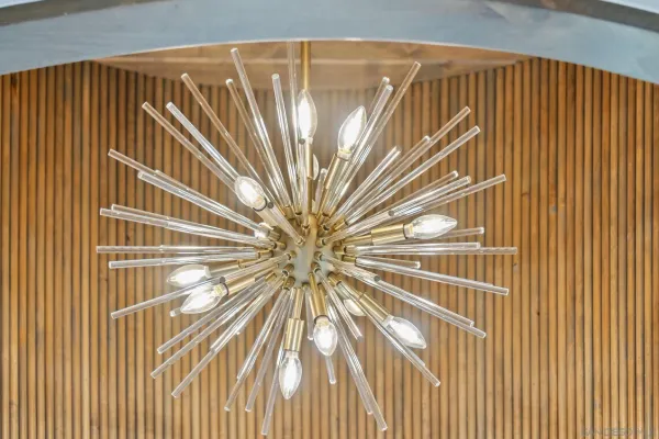 a kitchen that has a stove and a wooden floor