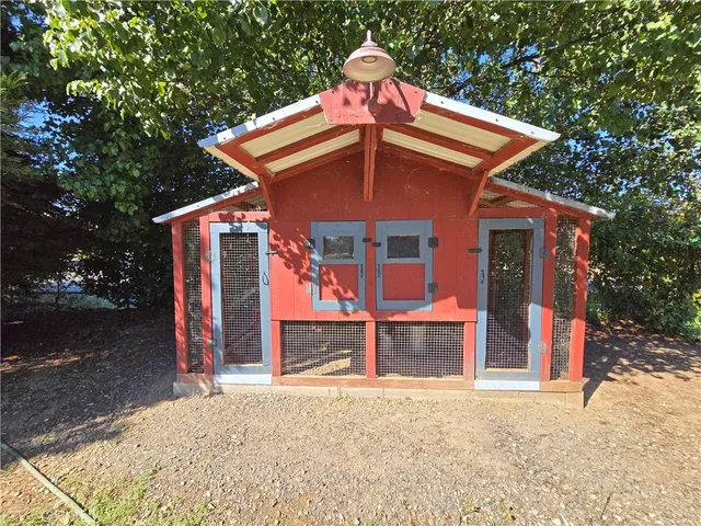 a view of a porch with a table and chairs