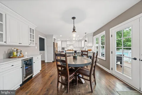 a kitchen with granite countertop a sink and wooden cabinets