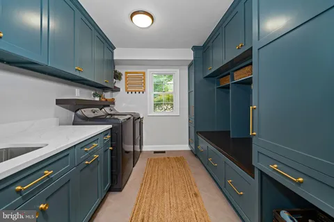 a kitchen with a refrigerator and a sink
