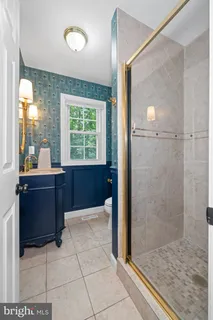 a bathroom with a sink a mirror and a toilet