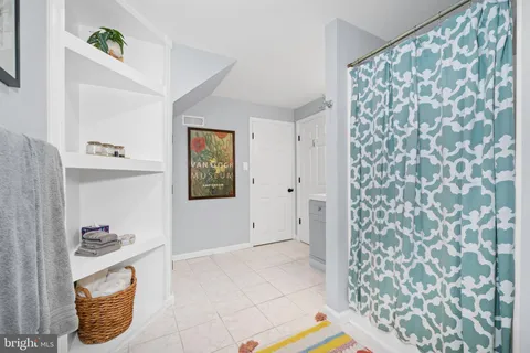 a view of a swimming pool with a lounge chair