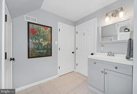 a view of a patio with table and chairs with wooden floor and floor to ceiling window