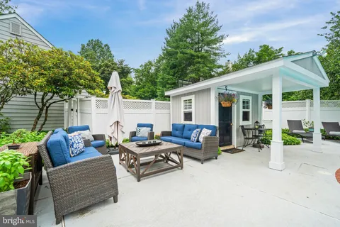 a view of a deck with wooden floor and barbeque oven