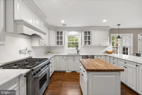 a kitchen with a stove and a refrigerator