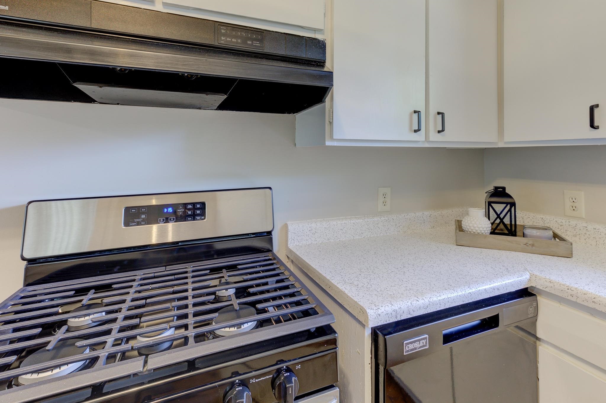 2823 Altruria Road Bartlett, TN 38134 - Photo 15 of 40 a stove top oven sitting inside of a kitchen