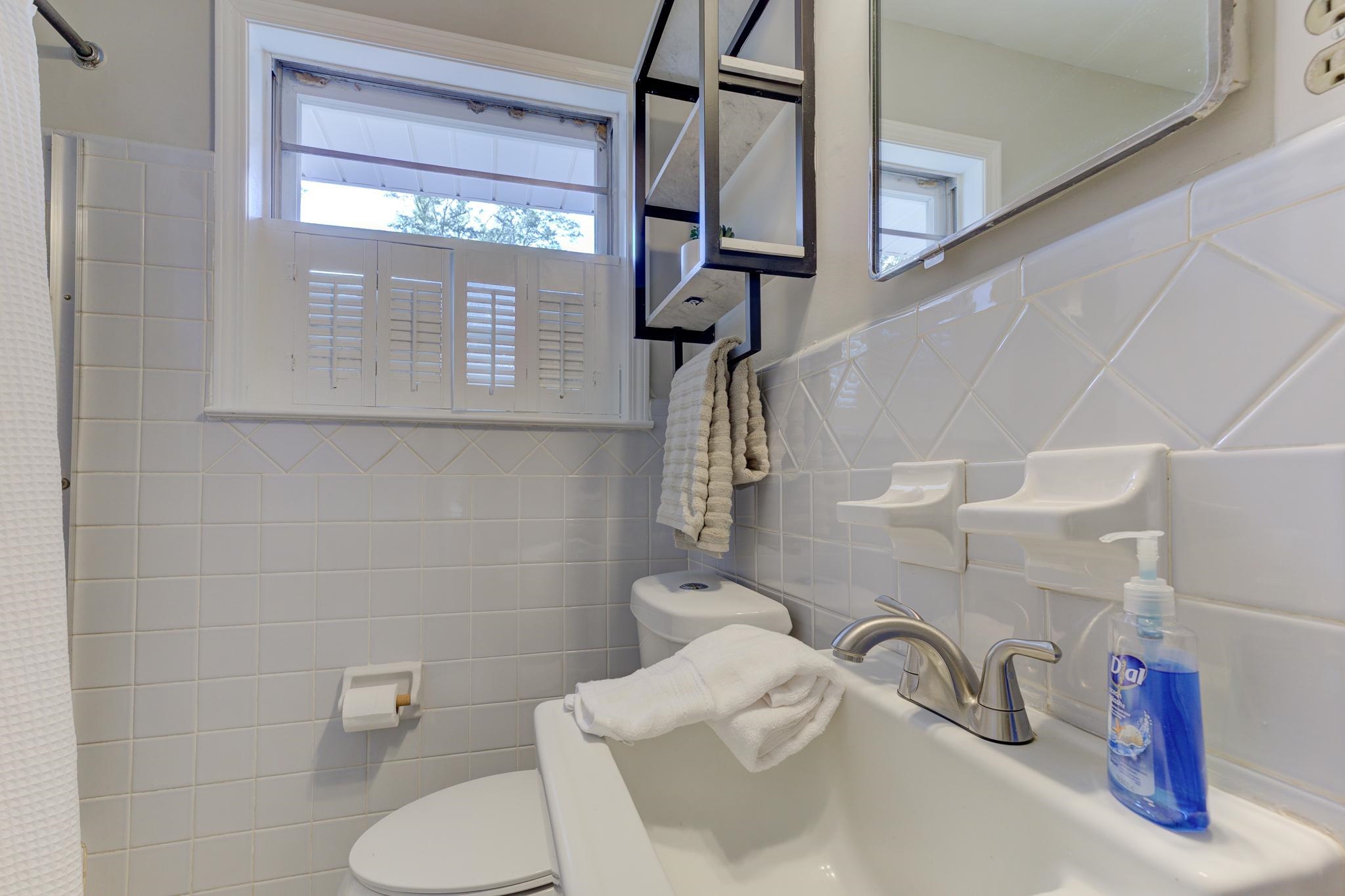 2823 Altruria Road Bartlett, TN 38134 - Photo 20 of 40 a bathroom with a toilet sink and mirror