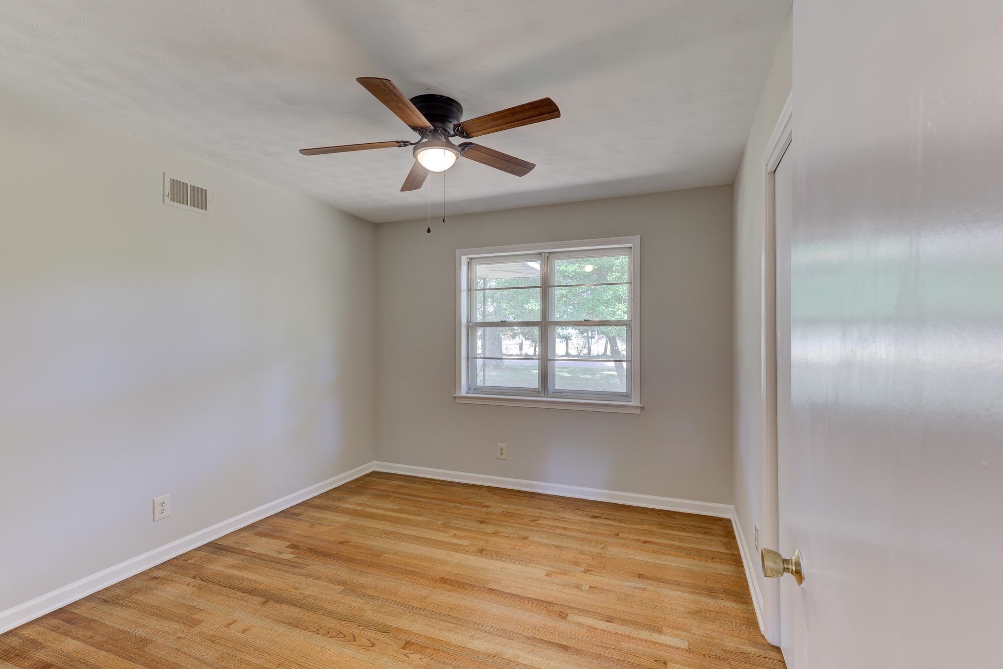 2823 Altruria Road Bartlett, TN 38134 - Photo 23 of 40 a view of empty room with wooden floor and fan