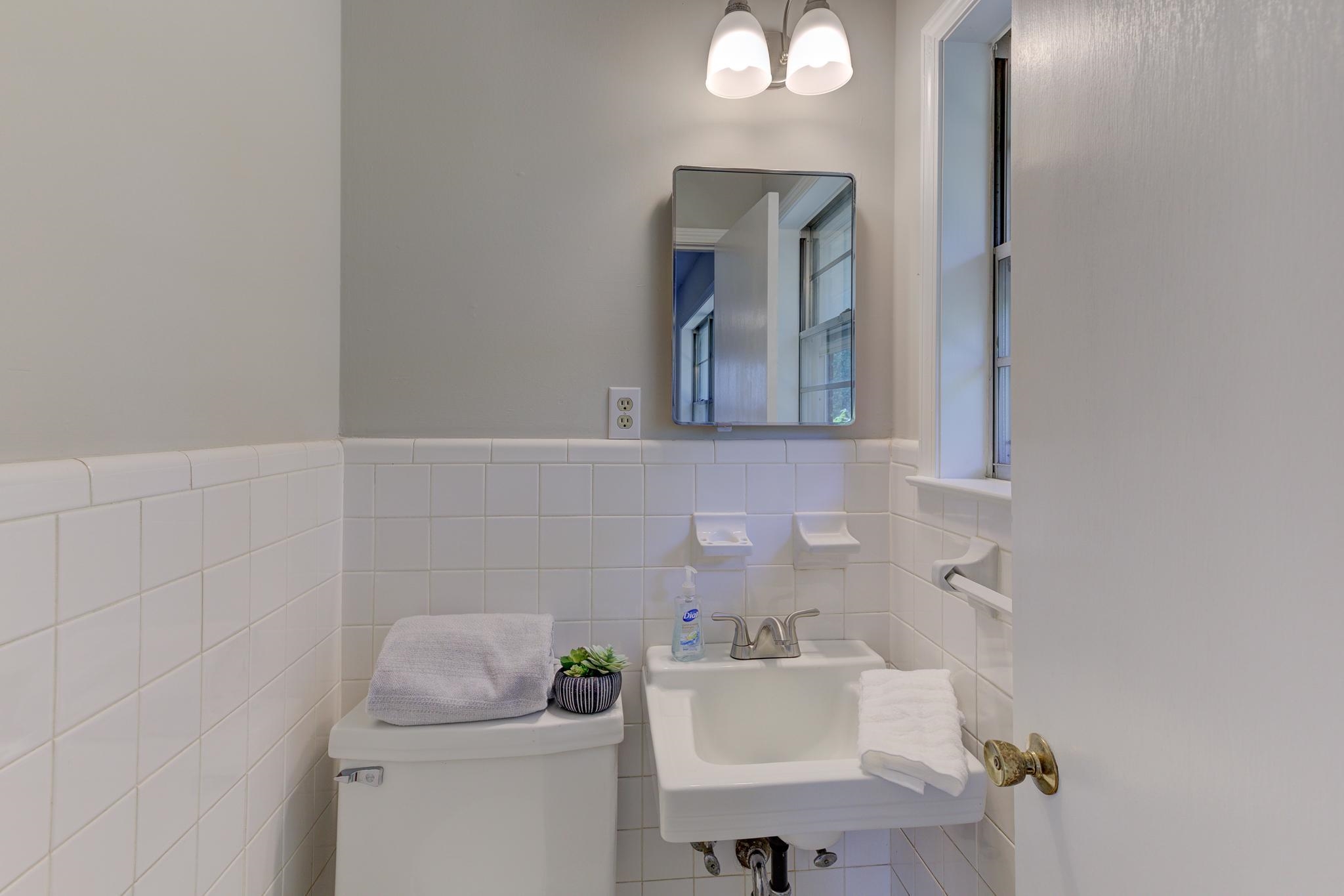 2823 Altruria Road Bartlett, TN 38134 - Photo 28 of 40 a bathroom with a toilet sink and mirror