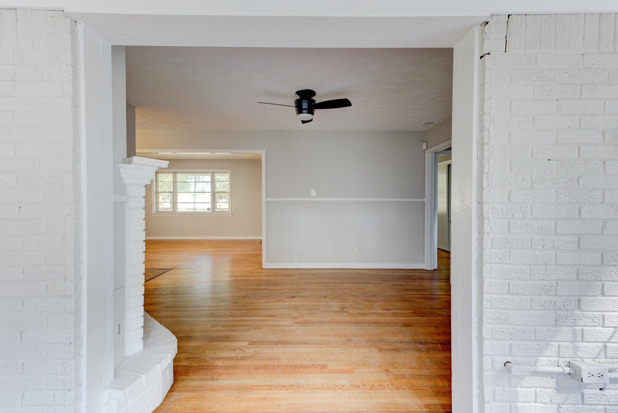2823 Altruria Road Bartlett, TN 38134 - Photo 3 of 40 a view of a livingroom with wooden floor and a bathroom
