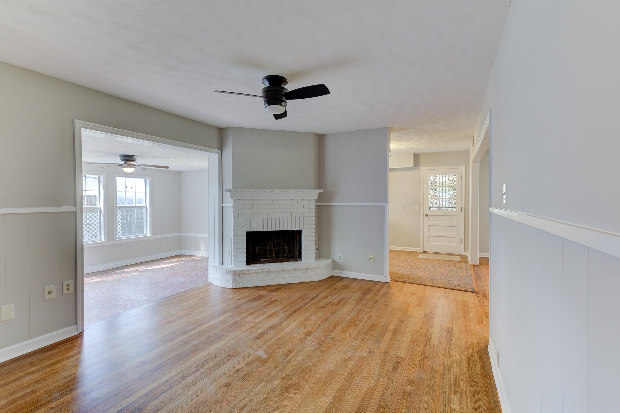 2823 Altruria Road Bartlett, TN 38134 - Photo 6 of 40 a view of empty room with wooden floor and fireplace