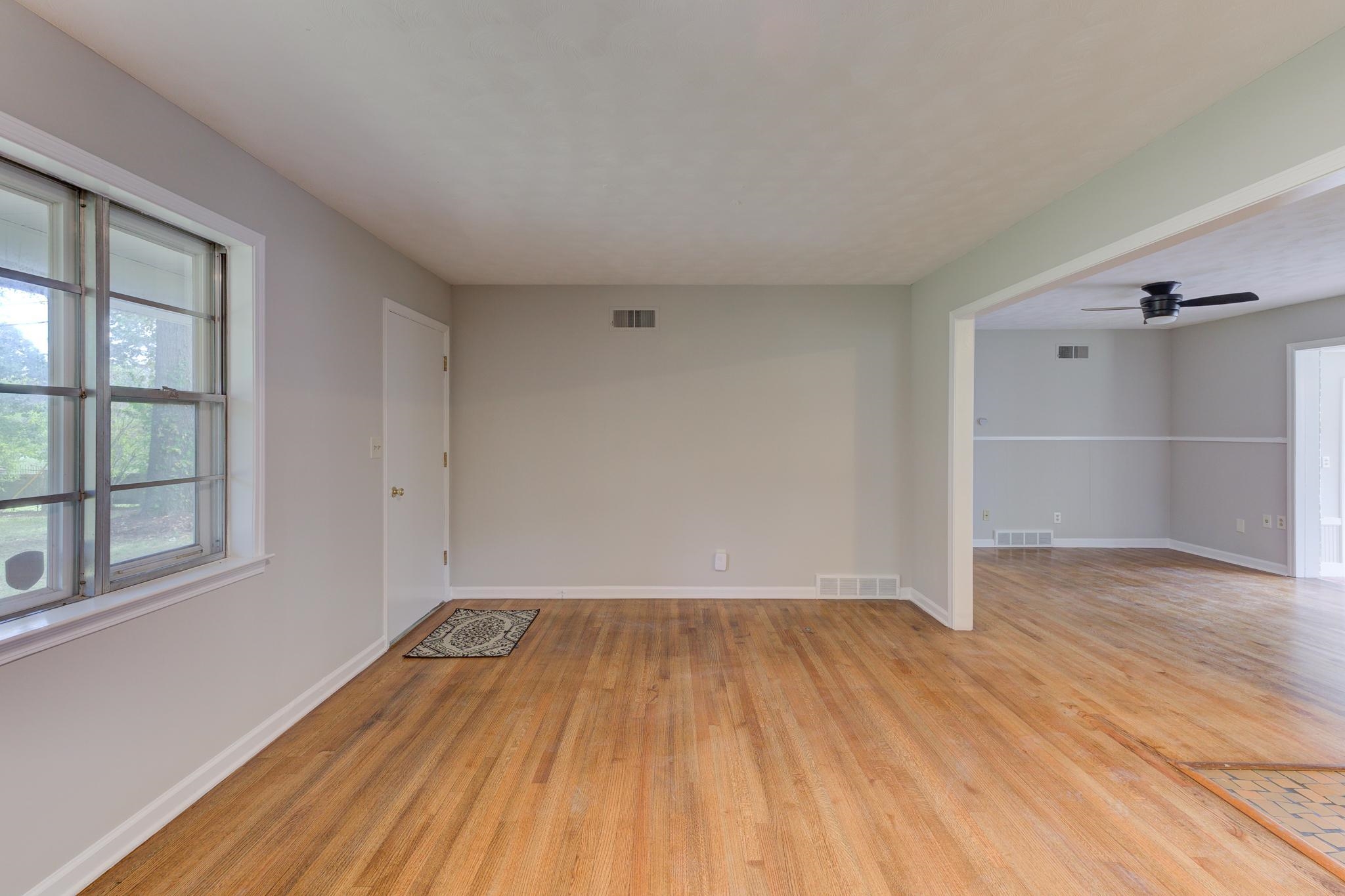 2823 Altruria Road Bartlett, TN 38134 - Photo 7 of 40 wooden floor in an empty room with a window