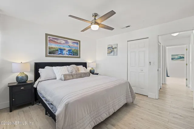 a bathroom with a toilet a sink a mirror a bathtub and shower