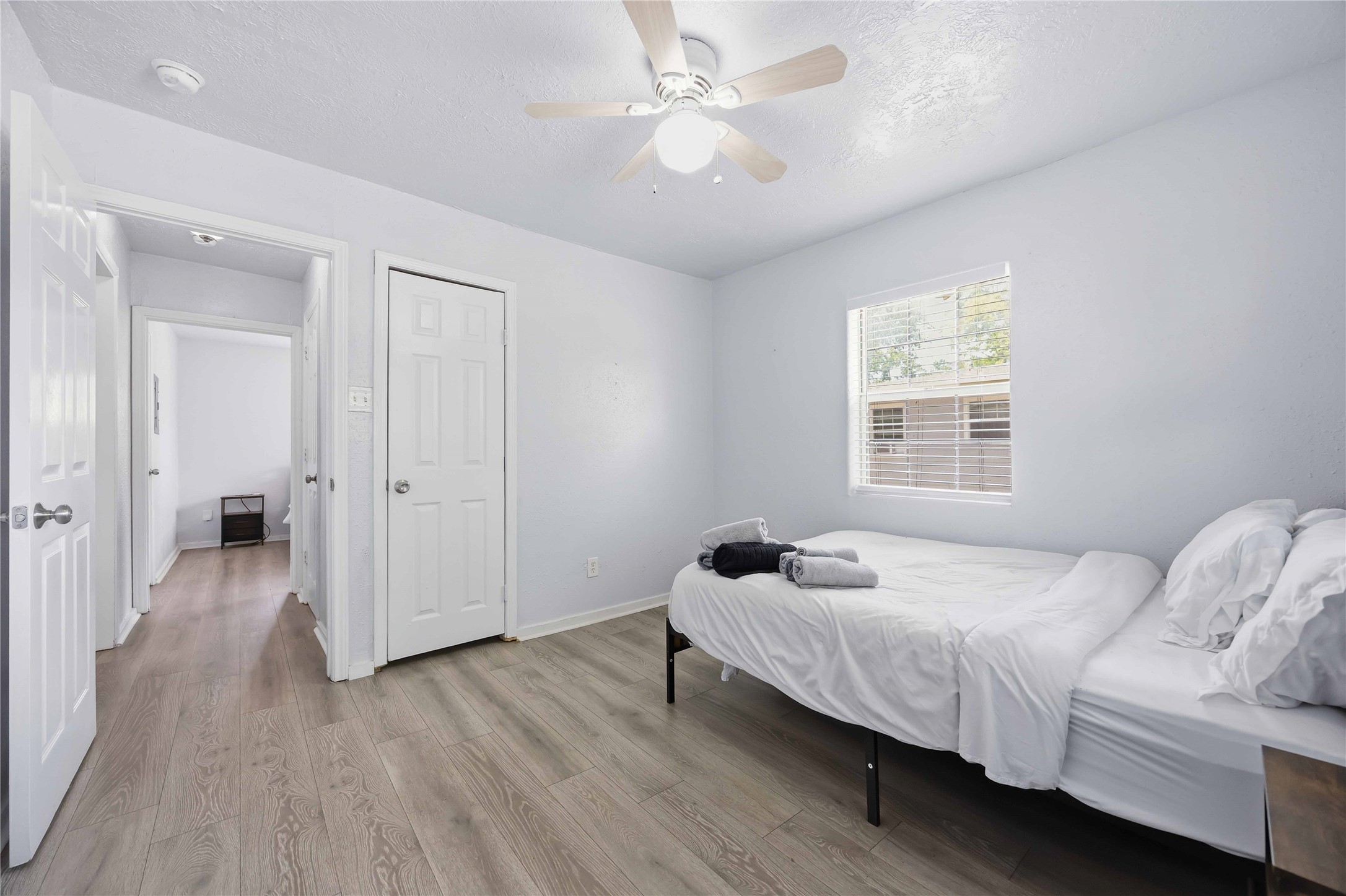 6726 Burkett Street Houston, TX 77021 - Photo 12 of 18 a bedroom with a bed and a window