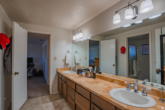 980 Cactus Circle St. George, UT 84790 - Photo 37 of 77 Full bathroom with double vanity and light colored carpet