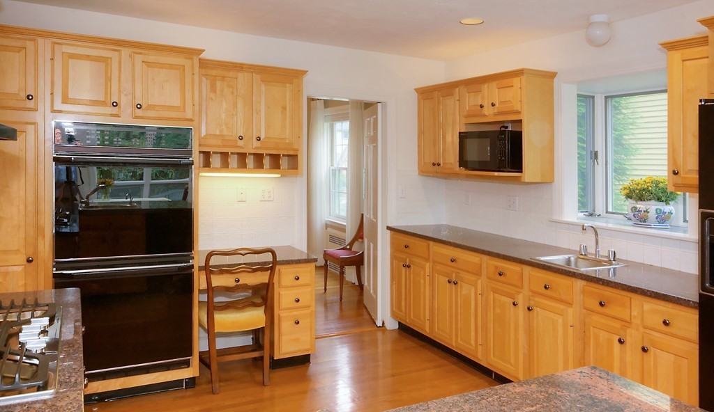 30 Rutledge Road Belmont, MA 02478 - Photo 11 of 30 a kitchen with stainless steel appliances granite countertop a refrigerator and a stove top oven