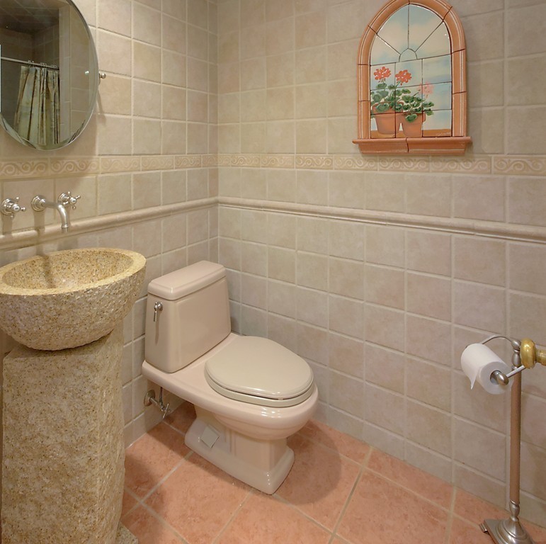 30 Rutledge Road Belmont, MA 02478 - Photo 17 of 30 a bathroom with a toilet a sink and mirror