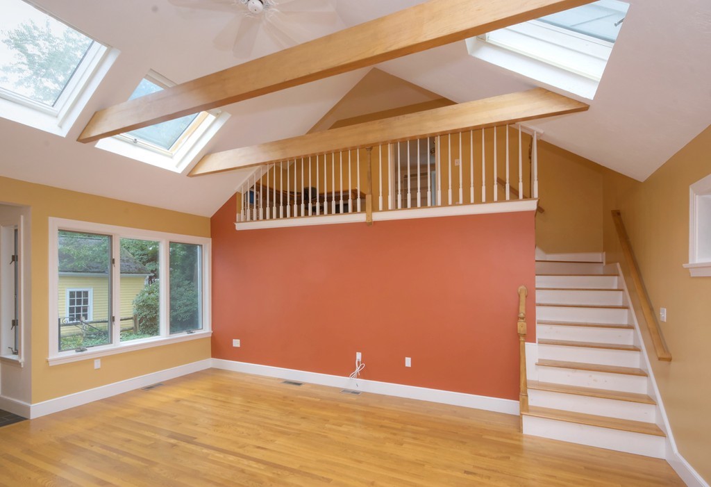 30 Rutledge Road Belmont, MA 02478 - Photo 19 of 30 a view of an empty room with wooden floor and windows