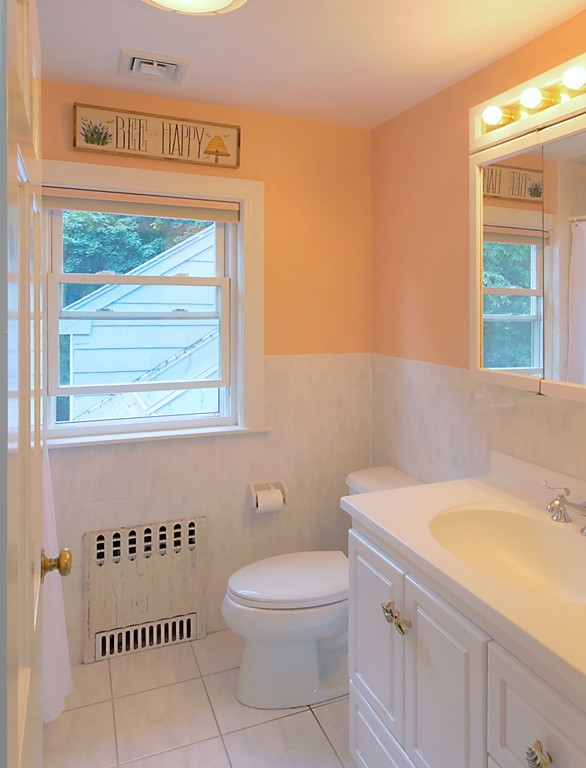 30 Rutledge Road Belmont, MA 02478 - Photo 25 of 30 a bathroom with a sink a toilet and a window