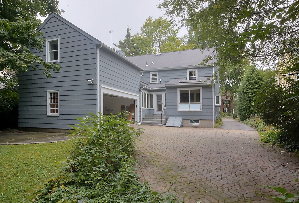 30 Rutledge Road Belmont, MA 02478 - Photo 29 of 30 a front view of a house with a garden and trees