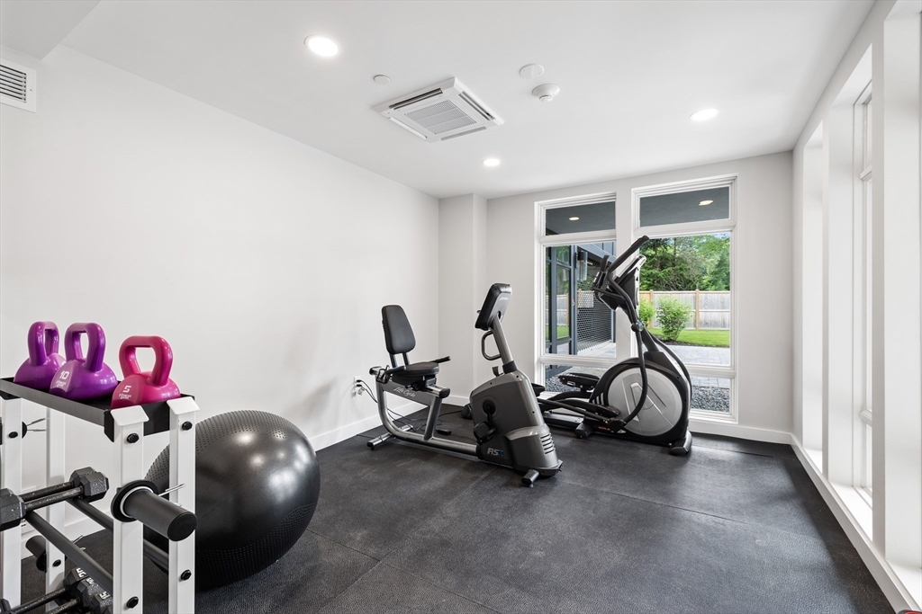 20 Kinmonth Road, Unit 108 Newton, MA 02468 - Photo 12 of 25 a view of a room with gym equipment