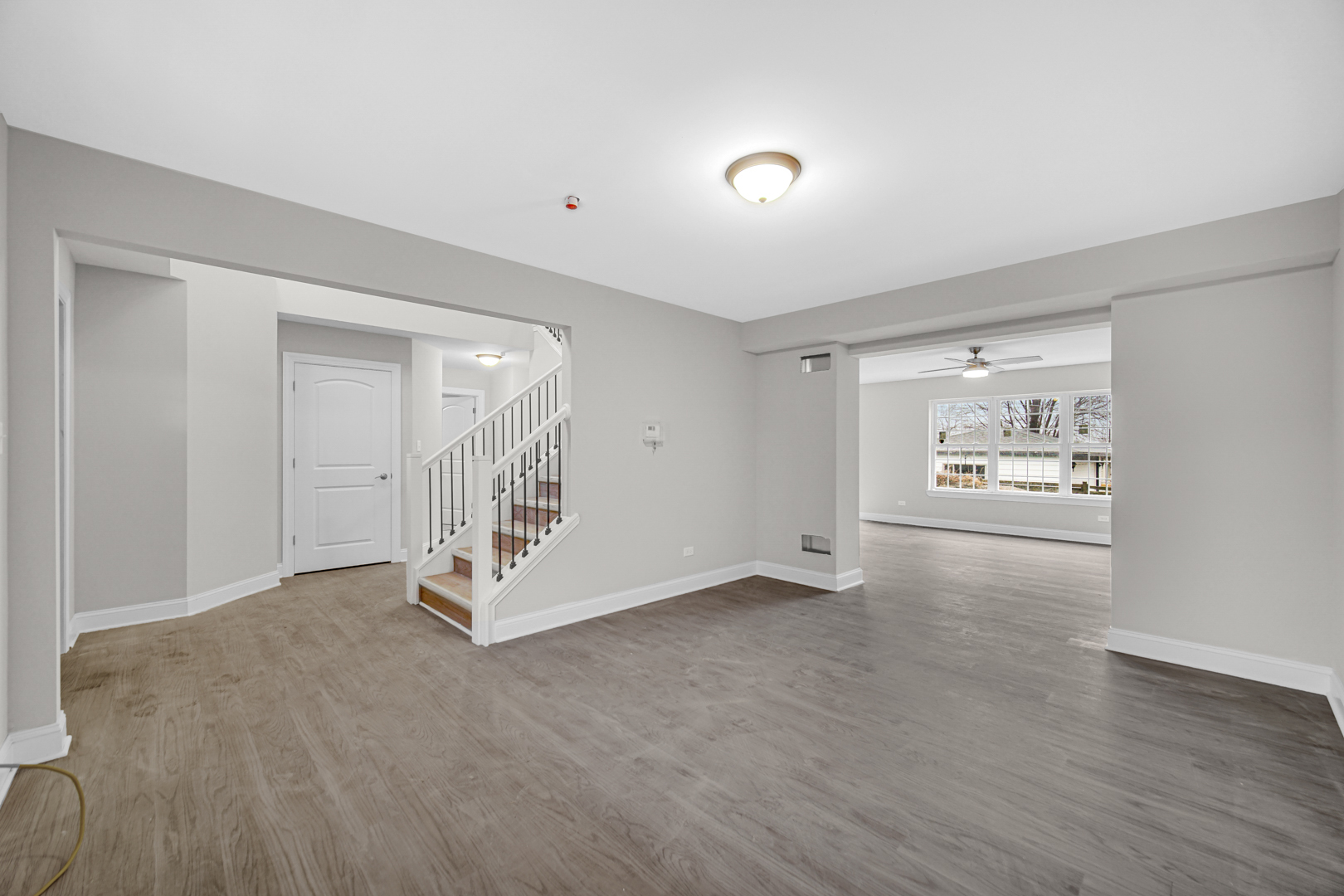5749 West 109th Street Chicago Ridge, IL 60415 - Photo 3 of 22 a view of an empty room with wooden floor and a window