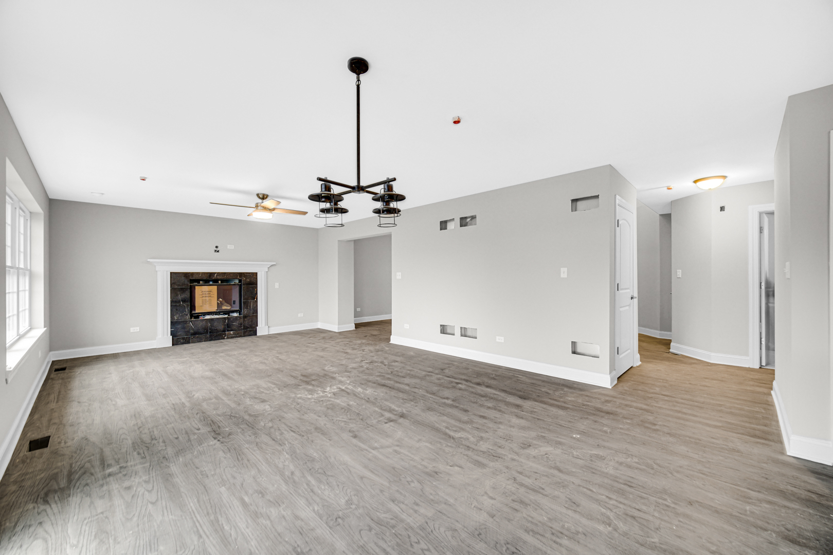 5749 West 109th Street Chicago Ridge, IL 60415 - Photo 8 of 22 a view of empty room with a fireplace and wooden floor