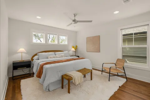 a bedroom with furniture and a window